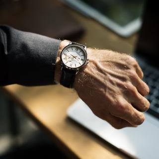 man looking at watch