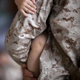soldier holding child