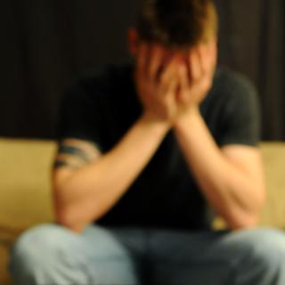 distraught man with pills