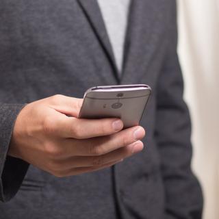 man holding cell phone