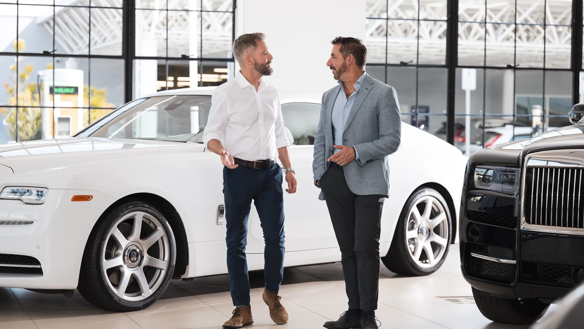 two men walking in dealership