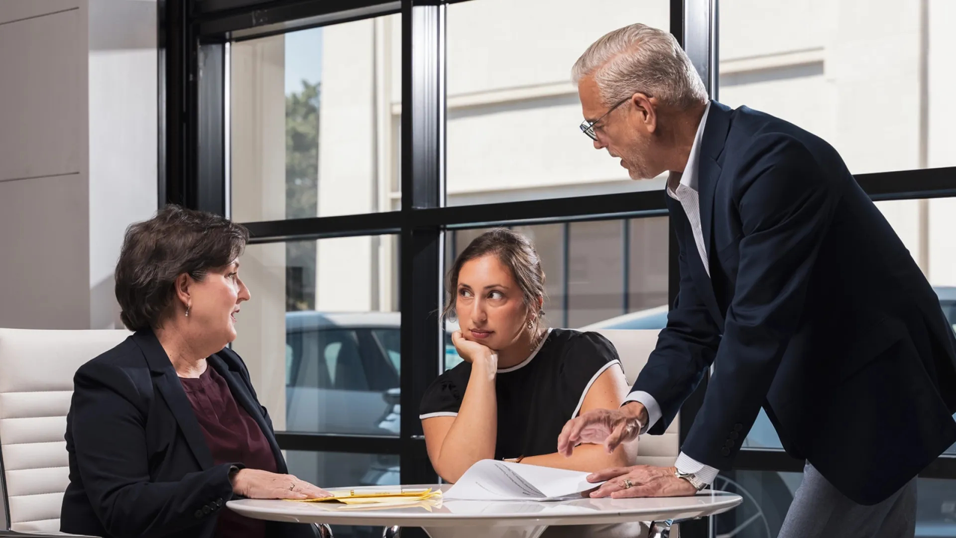 two highly rated real estate attorneys in California discuss with a client