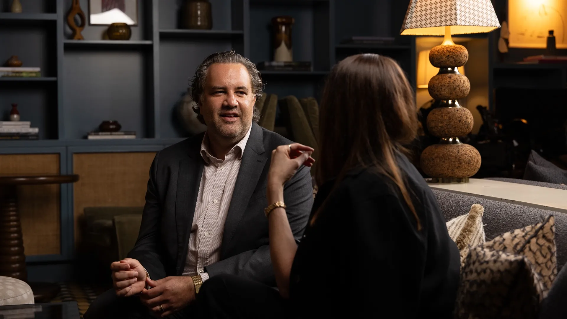 a successful complex litigation attorney discusses a case with a client